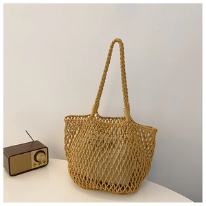 Minimalist woven tote bag in ginger yellow with mesh pattern and drawstring inner pouch