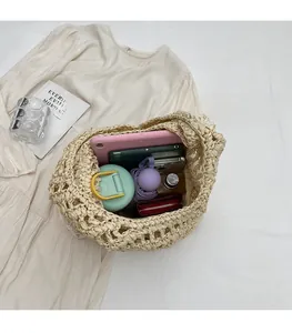 Top view of large capacity beige straw bag showing spacious interior with daily items
