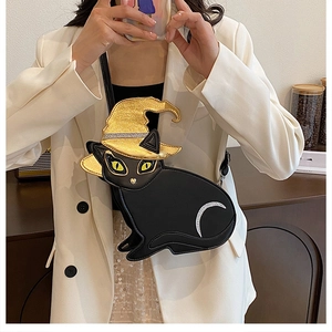 Detail shot of a black PU leather cat-shaped crossbody bag with a golden sequined witch hat