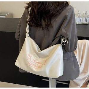 Chic beige PU crossbody bag featuring elegant pink bow and ruched shoulder strap detail