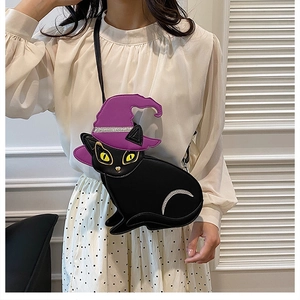 Detail view of Halloween black cat PU leather crossbody bag with purple wizard hat