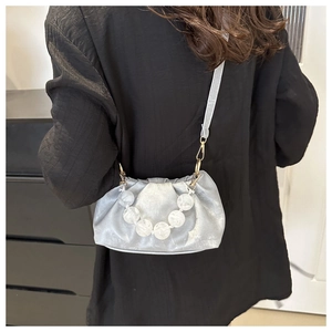 Light grey pleated crossbody bag with white marble bead chain and metallic fabric texture