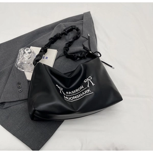 Minimalist black PU leather shoulder bag with ruched strap and stylish bow graphic
