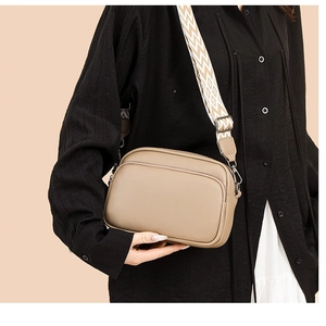 Khaki PU leather crossbody bag with wide ethnic shoulder strap and dual zipper design