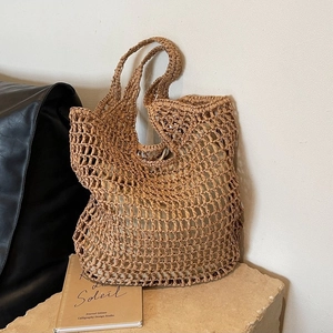 Fashionable hollow straw woven tote bag in camel color with internal fabric lining