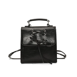 Classic black PU leather backpack with cross-lace bow detail and polished vintage style