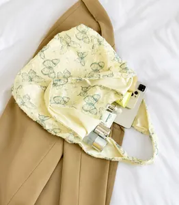 Detailed interior view of a cream lace tote bag showing large storage capacity