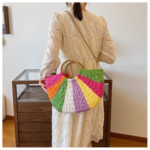 Fashionable colorful woven straw handbag with bright stripes shown as a crossbody bag style