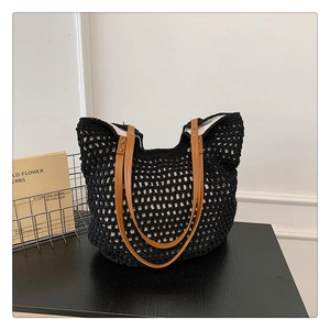 Fashionable black crochet knit tote bag with brown leather straps for women's daily use
