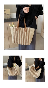 Detail of vintage woven tote bag featuring brown leather straps and striped straw texture