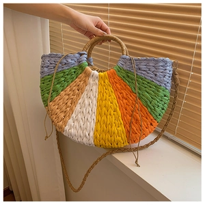 Colorful semi-circular woven straw handbag with vibrant rainbow stripes and round handles