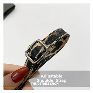 Detail of adjustable leopard print PU leather shoulder strap with silver metal buckle