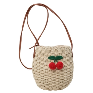 Straw bucket bag for women with woven cherry charm and brown shoulder strap