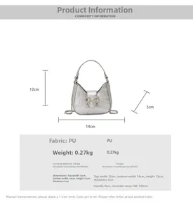 Detail view of silver crocodile embossed PU leather handbag with rhinestone bow buckle