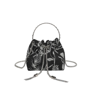 Chic black fabric bucket bag with silver floral embroidery and round metal handles