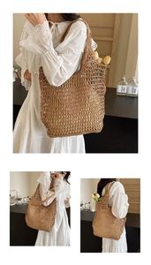Detail of handmade woven straw tote bag with mesh pattern and long shoulder straps