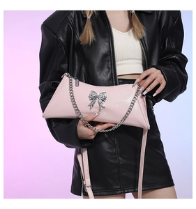 Pink PU trapezoid shoulder bag featuring a silver metal bow buckle and dual straps