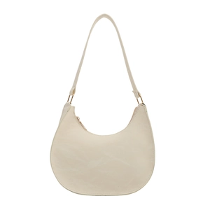 Minimalist beige crescent shoulder bag in textured PU leather with adjustable strap