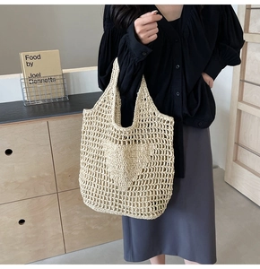 Detail of hand-woven beige cotton mesh tote bag with intricate crochet wave pattern