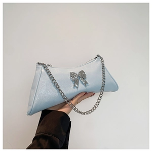 Chic light blue PU leather shoulder bag with silver bow accent and chain strap