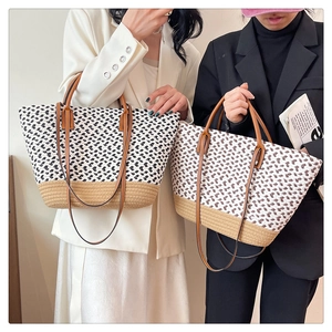 Detail of two woven tote bags featuring mixed patterns and durable brown leather straps