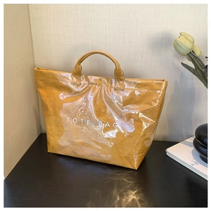 Fashionable Tyvek tote bag with transparent outer layer and mustard yellow inner liner