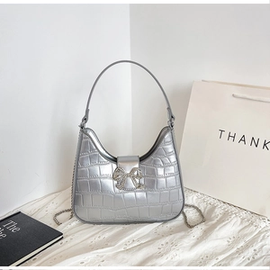 Silver crocodile pattern crescent moon bag with rhinestone bow and metal chain strap