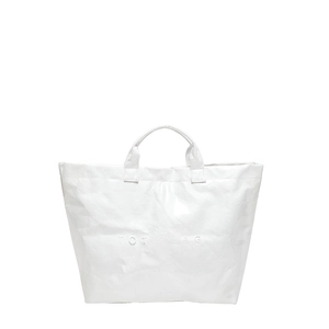 Minimalist white DuPont paper tote bag with embossed lettering and wrinkled texture