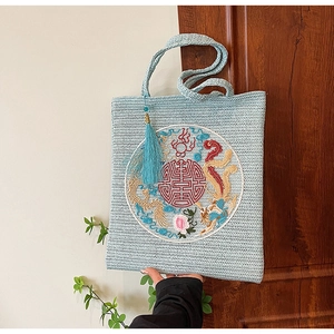 Light blue woven tote bag with Chinese dragon and phoenix embroidery and long tassels