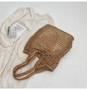 Overhead view of a brown woven mesh tote bag with cotton rope material and inner lining