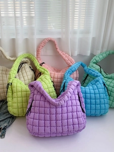 Quilted cloud puffer tote bag in multiple colors with adjustable drawstring side detail