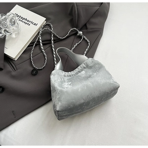 Silver PU leather crossbody bag with chain strap and elegant pleated design in grey setting