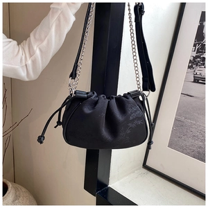 Detail of black cloud-shaped crossbody bag featuring bamboo leaf jacquard texture