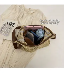 Macro shot of spacious interior for straw tote bag with brown leather handles