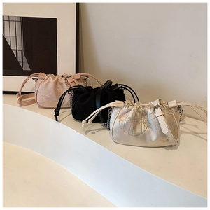 Minimalist drawstring crossbody bag in satin fabric with floral embroidery options