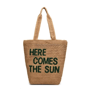 Minimalist straw shoulder bag with Here Comes The Sun green embroidery for women