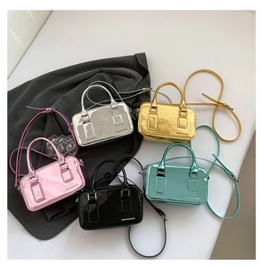 Various colors of mini Boston crossbody bags in metallic and patent leather finishes