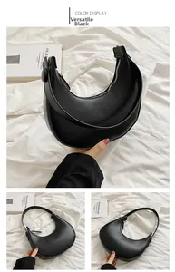 Detail view of the black crescent shoulder bag with matte leather and metal zipper