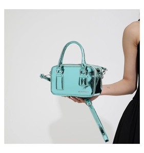 Detail view of Tiffany blue PU leather crossbody bag featuring metal buckle and brand logo