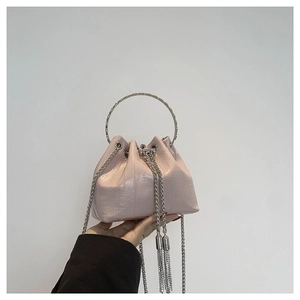 Pink PU leather mini bucket bag with silver metal handle and fringe tassels