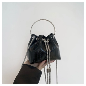Chic black glossy PU leather bucket bag with silver metal drawstring and round top handle