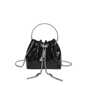 Fashionable black faux leather bucket bag with glossy finish and silver ring handle