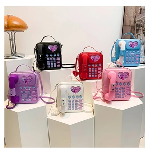 Retro telephone-shaped crossbody bags in six vibrant colors with dial plate detail