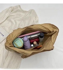 Top view of woven tote bag interior showing large capacity for umbrella and cosmetics