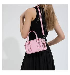 Detail showing pink metallic PU leather texture and Fashion & Bags logo on crossbody bag