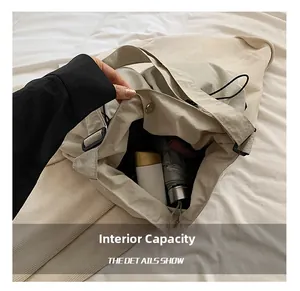 Detail showing internal capacity of the off-white nylon crossbody bag for daily essentials