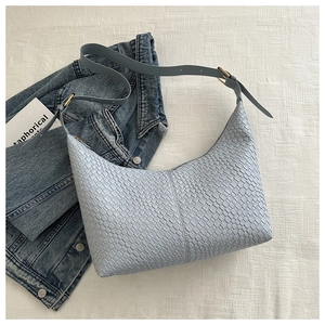 Light blue woven PU leather crescent moon shoulder bag with gold hardware and adjustable strap