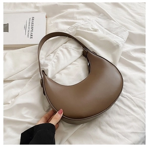 Minimalist brown PU leather half-moon shoulder bag with a sleek zipper closure