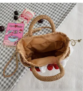 Top view of handmade straw bucket bag showing neat interior lining and drawstring closure
