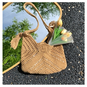 Chic hand-woven crochet shoulder bag with elegant fringe tassels for summer beach vacation